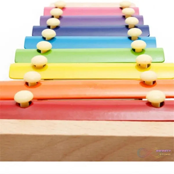 Wooden xylophone with colorful bars and mallet, suitable for children