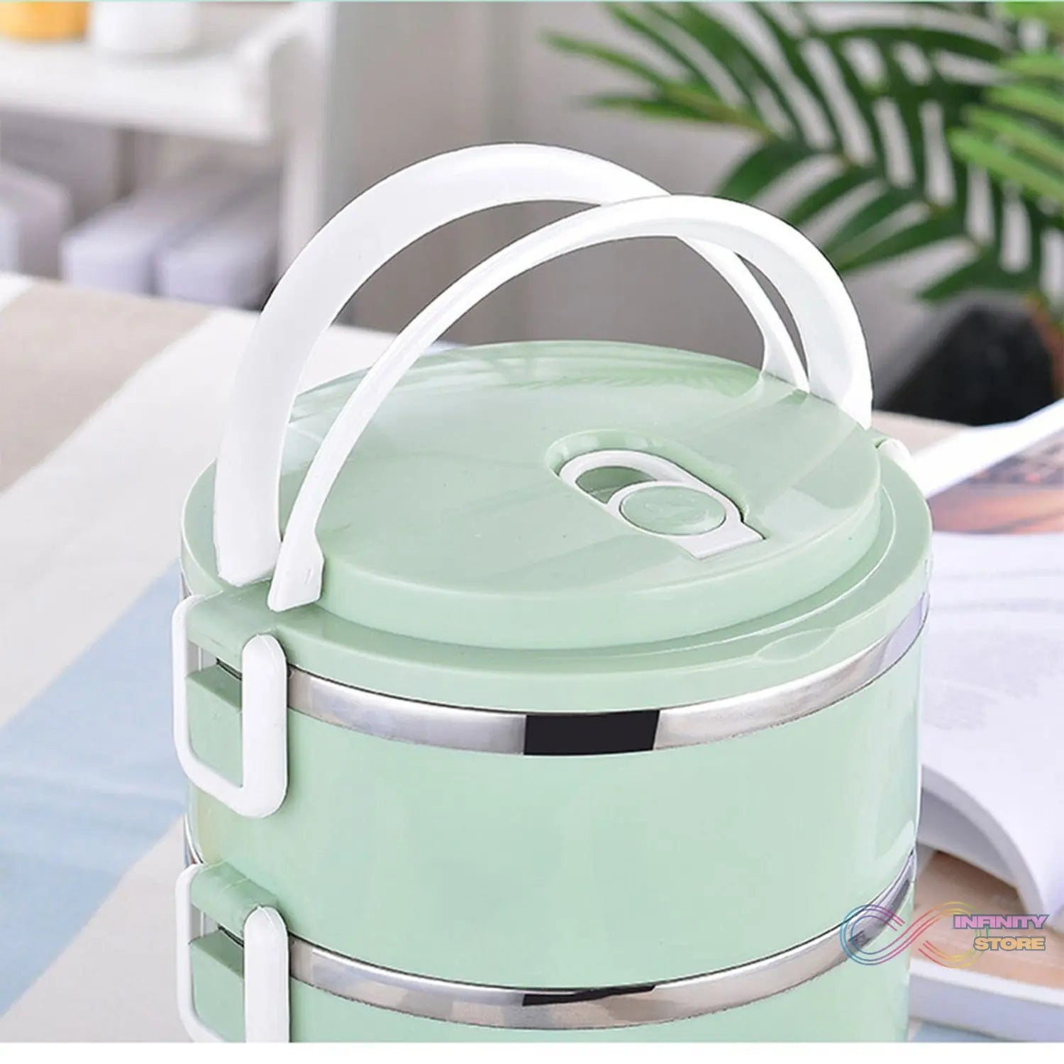 Four compartment stainless steel lunch box.