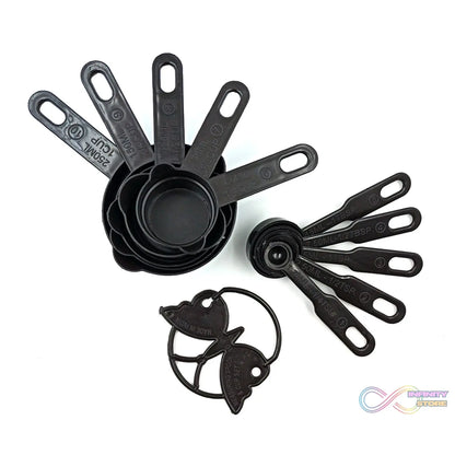 Set of black plastic measuring cups and spoons, featuring a butterfly-shaped holder for organization
